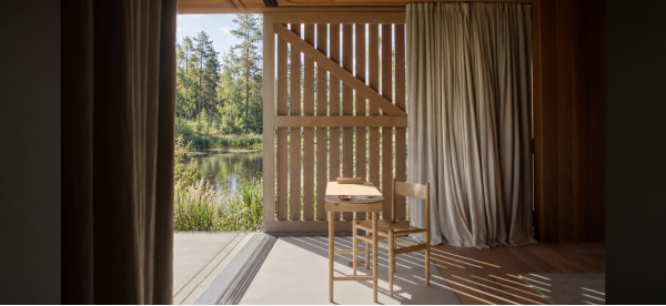 Visualization of the interior of Gaismas māja with wooden trim, light curtains and a view of a pond through open shutters Visualization of the interior of Gaismas māja with wooden trim, light curtains and a view of a pond through open shutters